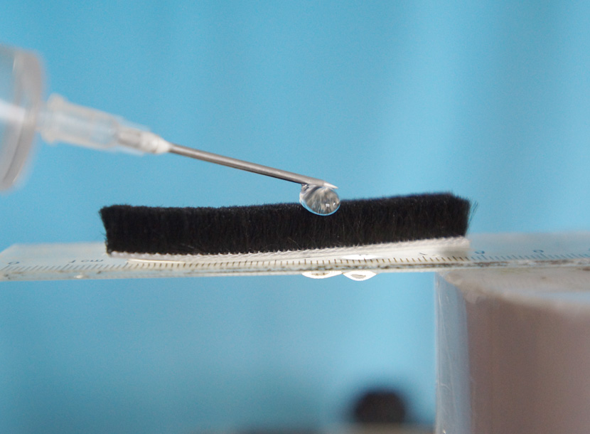 Water beading on the silicone-treated filament instead of soaking in.
